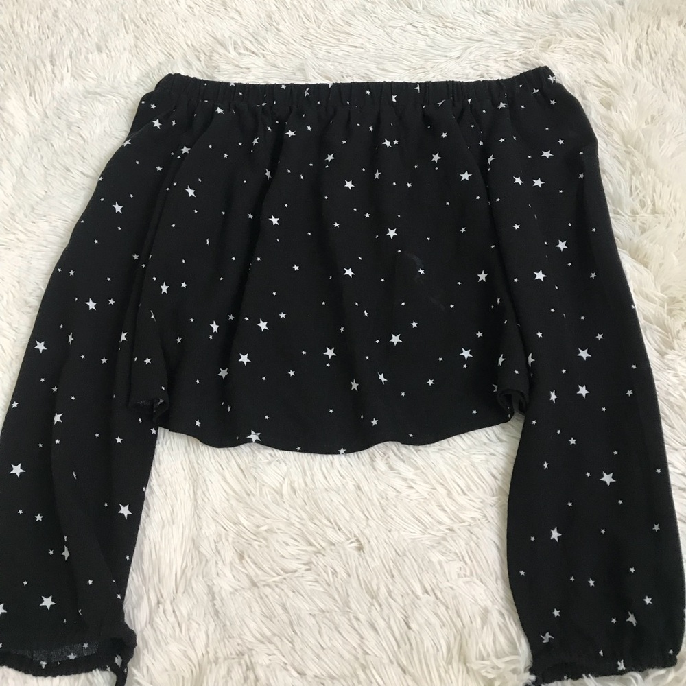 A black off the should top with stars